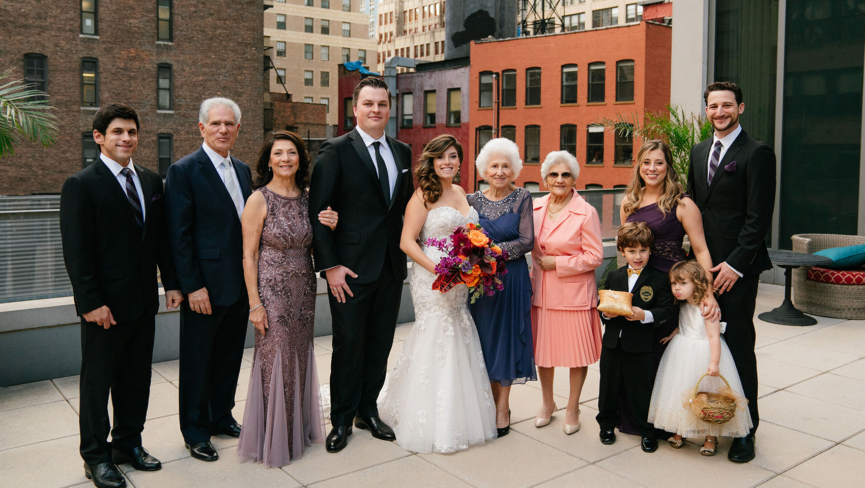 April and Daniel with family members on their wedding day
